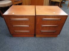 A pair of 20th century teak G plan three drawer bedside chests