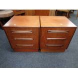 A pair of 20th century teak G plan three drawer bedside chests