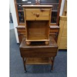 A mid 20th century flap sided two tier tea trolley together with a pine swivel adjustable armchair