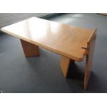 A 20th century Heals oak extending twin-pedestal dining table