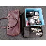 A tray containing a leather hand bag, pair of sunglasses, Nokia mobile phone,