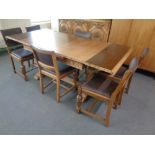 A 1930's eight piece Lees style dining room suite comprising of heavily carved triple door buffet