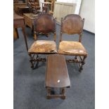 A small drop leaf table together with a pair of 19th century carved beech and studded leather