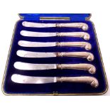 A cased set of six silver handled butter knives