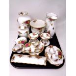 A tray containing sixteen pieces of Old Country Roses china including a pair of candlesticks,