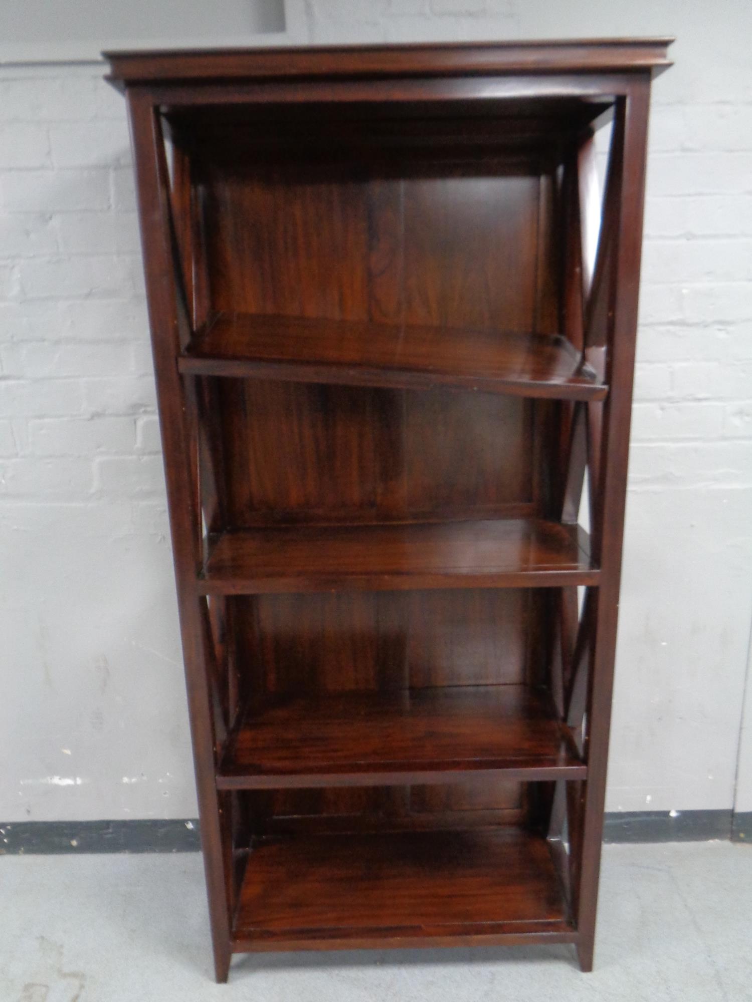 A mahogany effect open book case