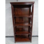 A mahogany effect open book case