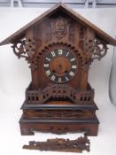 A 19th century heavily carved pine Gothic cuckoo clock (as found)