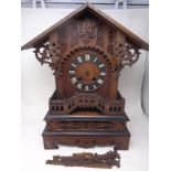 A 19th century heavily carved pine Gothic cuckoo clock (as found)