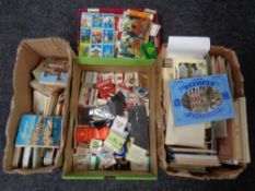 A box containing a large quantity of books and postcard snap shot albums