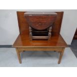 A turnover top coffee table together with a oak drop leaf occasional table