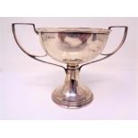 A silver twin handled trophy cup,