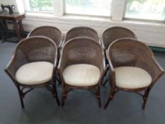 A set of six bamboo and wicker armchairs