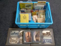 A crate containing old maps and books including French postcard album,