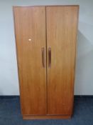 A 20th century teak G plan double door wardrobe