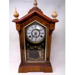 An antique American eight day striking clock by Jerome & Co.