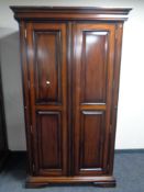 A contemporary mahogany effect two door wardrobe