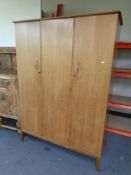 A mid 20th century teak Handcraft Quality Furniture five piece bedroom suite comprising of triple