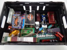 A crate containing a large quantity of boxed and unboxed die cast vehicles,