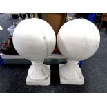 A pair of concrete ball finials.