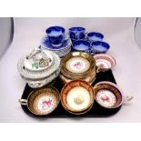 A tray containing continental blue and white teacups and saucer,