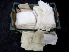 A box containing a quantity of table linen to include a hand made table cloth