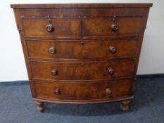 A Victorian mahogany bowfronted chest of five drawers