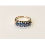 A gold sapphire five stone ring, size L CONDITION REPORT: 4.7g, apparently unmarked.