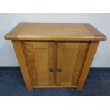 A contemporary oak two door low cabinet,