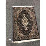 A Tabriz design rug 64 cm x 91 cm