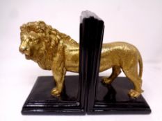 A pair of contemporary book ends modelled as a lion