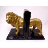 A pair of contemporary book ends modelled as a lion