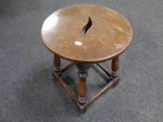 A circular joined oak stool
