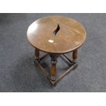 A circular joined oak stool