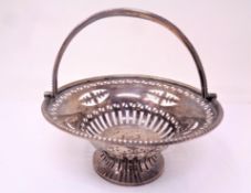 A pierced silver swing handled basket, Chester marks.