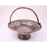 A pierced silver swing handled basket, Chester marks.