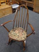 An Ercol rocking chair together with another armchair