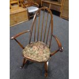 An Ercol rocking chair together with another armchair