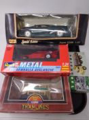 A Maisto special edition 1:18 Jaguar XJ220 Die cast car together with three further die cast
