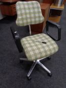 A 20th century swivel adjustable desk chair upholstered in a checked fabric