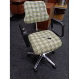 A 20th century swivel adjustable desk chair upholstered in a checked fabric