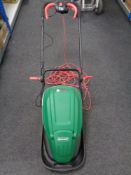 A Qualcast electric lawn mower with grass box and lead