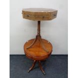 A yew wood pedestal drum table together with a octagonal pedestal table