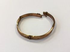 A 9ct gold bangle (damages) CONDITION REPORT: 8.