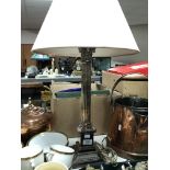 A silver plated Corinthian column table lamp with shade