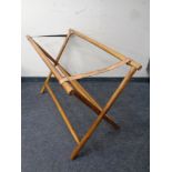 A folding fruit wood luggage cage stand