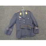 A post-war German tunic with earlier Luftwaffe badge sewn to breast