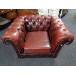 A Chesterfield oxblood buttoned leather club armchair (as found)