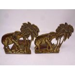 A pair of brass book ends modelled as elephants