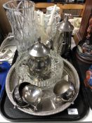 A tray containing a four piece silver plated tea service on circular tray,
